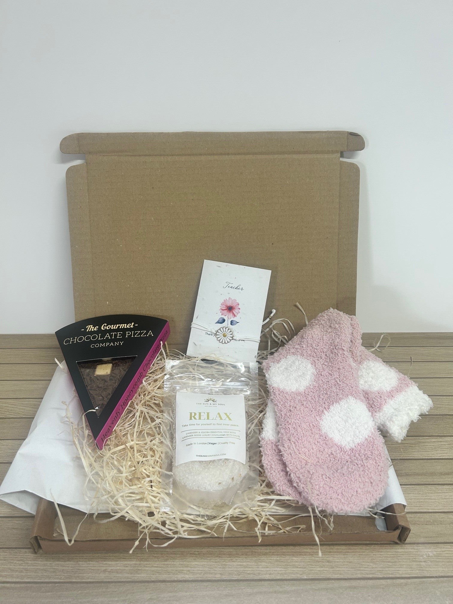 Teacher Thank You Treat Box with bath salts, cosy socks, chocolate slice, and bracelet with seed card